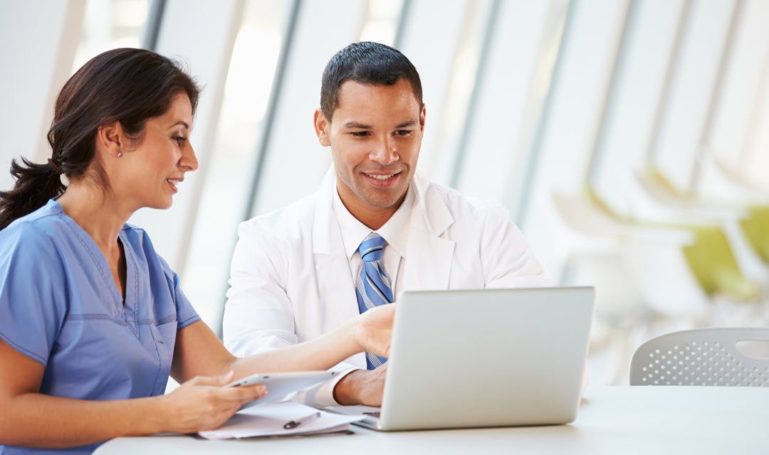 Providers looking at laptop